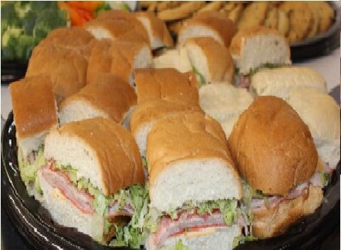 Sandwich, veggie, cookie/brownie trays, as well as 4 foot and 6 foot submarines for your catering needs!