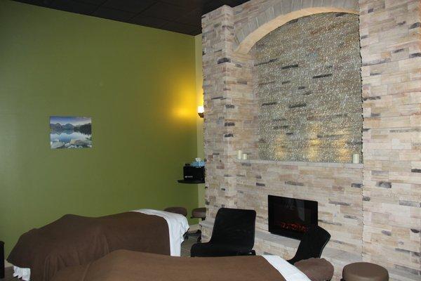 Elegant Couples Suite with Cultured Stone, Waterfall and Fireplace.