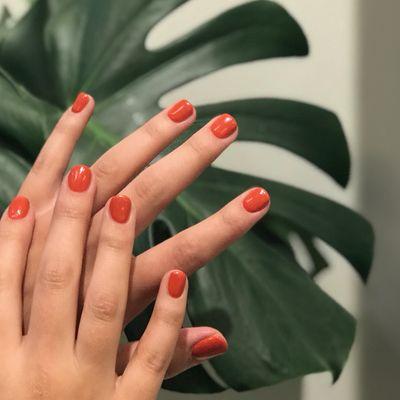 Crisp, red-orange, acrylic overlay