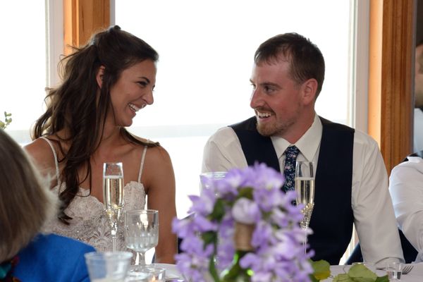 Happy & in love - sitting at the head table at Parkway Banquets.