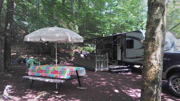 A Camper lounging at his seasonal campsite