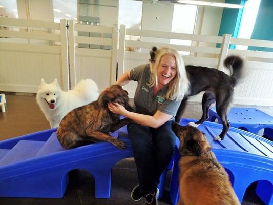 Linda, the owner, loving playing with the dogs!