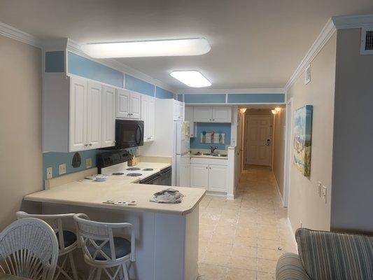 Kitchen after popcorn ceiling removal, patching ceiling, and repainting all ceilings, walls, and trim