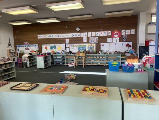 Main classroom area with lots of activities on the shelves