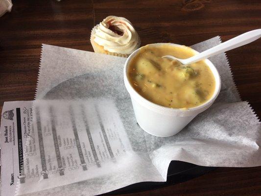 Broccoli cheddar soup and a strawberry shortcake cupcake