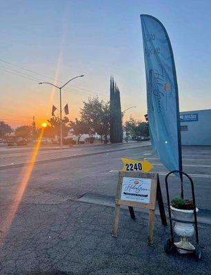 The store is open anytime you see the teal flag out front! Just go through the gate to get to HelenGrace located behind Lash's Glass