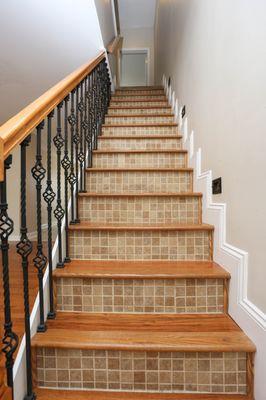 Tiled risers on stairs and lighting.