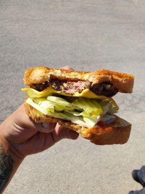 Cheeseburger mid-bite