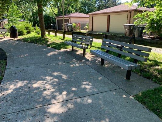 Benches and garbage can nearby.