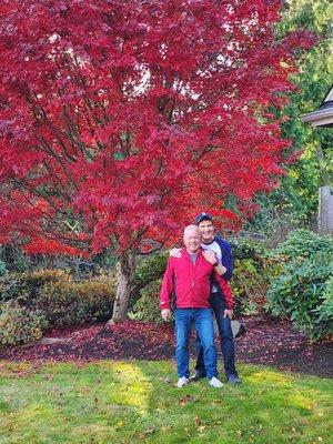 Me and my spouse in the front yard.