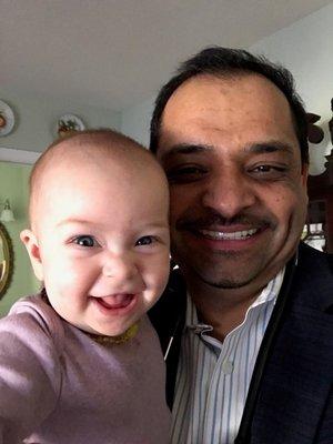 Dr. Patel with family member having a little