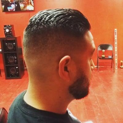 Cut: medium razor fade w/scissor trim up top.