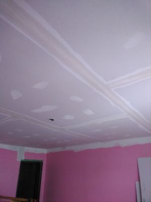 Taping coat of mud on drywall over plaster