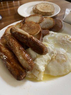 Sausage links, eggs, homemade potatoes and toast