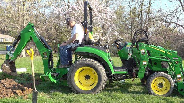 Our john deere 2038R with every attachment.