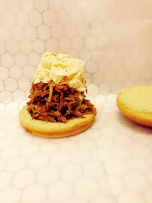 Small Smoked BBQ Pulled pork sandwich with cole slaw on top!