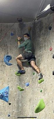 my cousin john climbing the green rocks