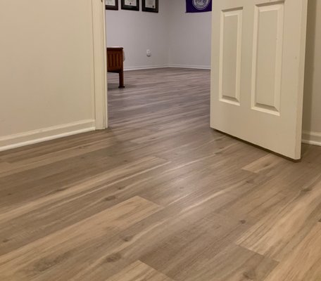 Mannington Adura luxury vinyl  installed in a basement with no thresholds for easy transitioning from room to room.