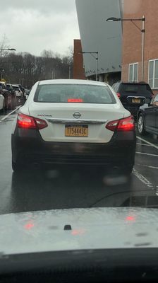 This Car cut me off, nearly hit two women and blew a stop sign picking up two students at the school!