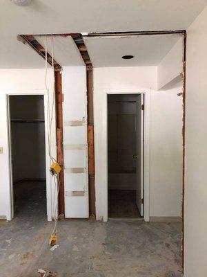 After - Demolition of the existing bedroom door and hall closet to create a private bedroom suite.