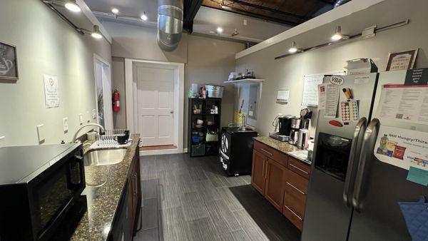 Communal kitchenette for members to use. Kombucha on tap and k-cups are provided by the CoLab.