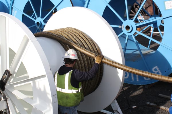 Moving Transmission Cable from bad reels to New Reels built by us.