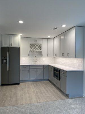 Basement wet bar. Two tones cabinets