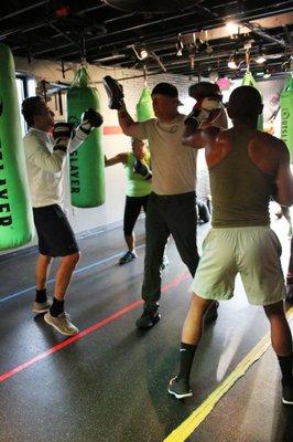 Using the focus mitts during a bag class!