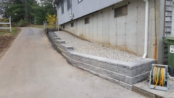 Retaining wall we installed along customers house and driveway.