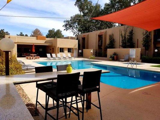 Large Pool with Bar Seating by the BBQ and Shade Sails