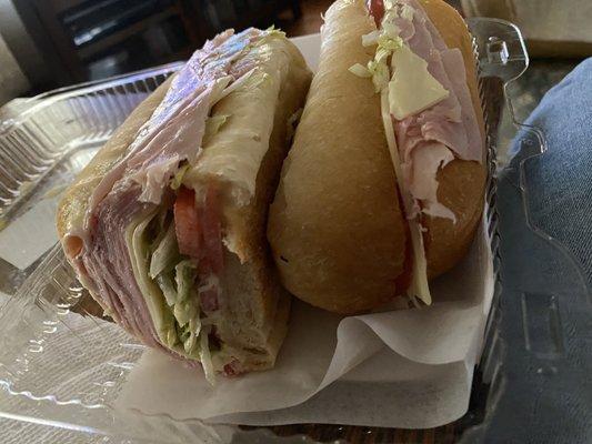 The stack of meat on this yummy ham and cheese grinder.