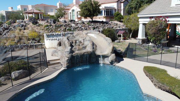 Turn your old pool into a modern & relaxing oasis, like adding a Waterfall Grotto Slide.
 #PoolRemodel #WaterfallSlide