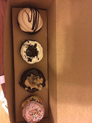 Four cupcakes waiting to be devoured.