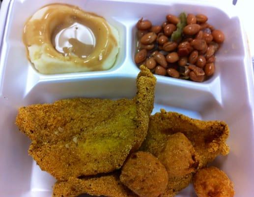 Fish dinner - 2 pieces of fish, 2 sides, and hush puppies.