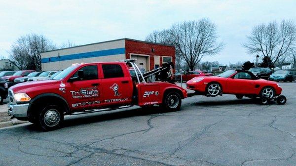 Tri-State towing, pulling a car away.