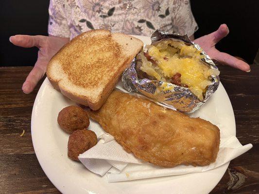 Fish, loaded baked potato and hush puppies