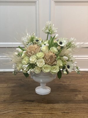 white mix including dried artichokes, agapanthus, anemone, tulips, and a touch of feathers