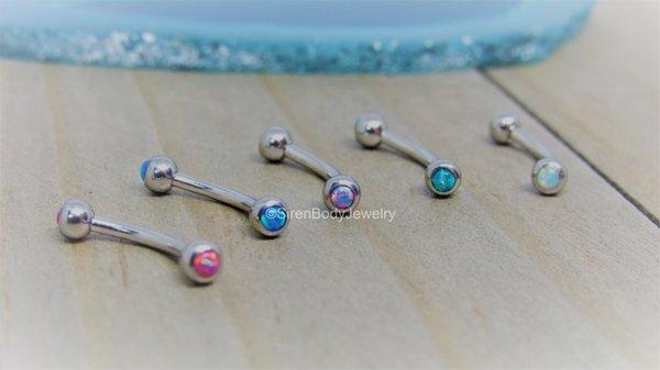 16g Opal curved barbells available in-store and online at SirenBodyJewelry.com