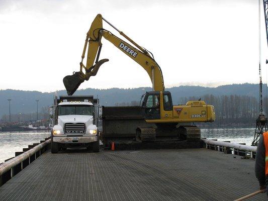 We have big box hauling capability and tarped trailers ideal for hauling contaminated soil, municipal solid waste and construction materials