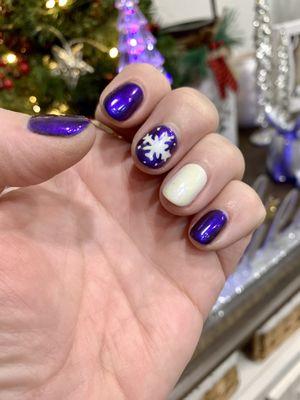 This is a gel mani with chrome polish & hand painted snowflake! Beautiful job! I've received so many compliments! Love Koo Nails!