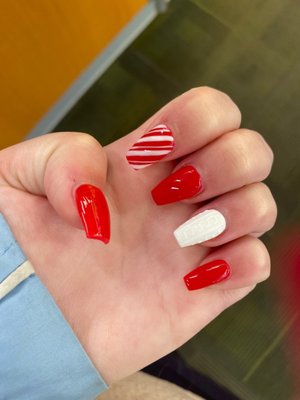 Candy cane, sweater holiday nails.