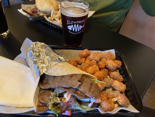 Gyero & truffle tots with a red beer