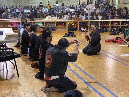 Instructors toasting newest Black Belt recipient