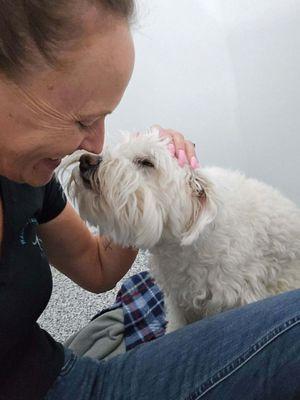 Our doggie with staff at Wagging Tails.