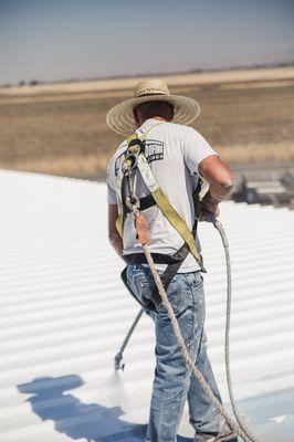 Spraying a roof in Chico, California