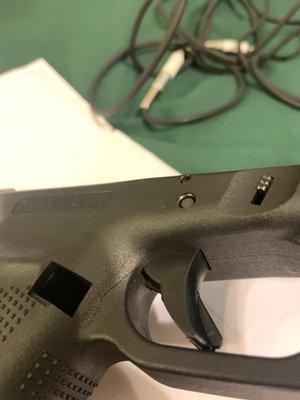 Right behind the trigger guard you can see a hairline crack rendering the pistol unsafe!