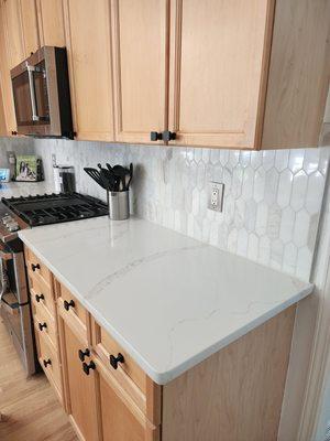 Quartz Countertops and backsplash.