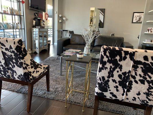 Super cute waiting area in the center of this open concept salon.