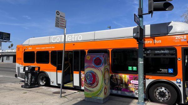 Corner of shell station has two bus stops