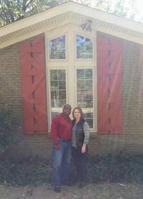 My wife and I in front of the Cross on our garage!